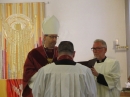 The Priest stands before the Bishop